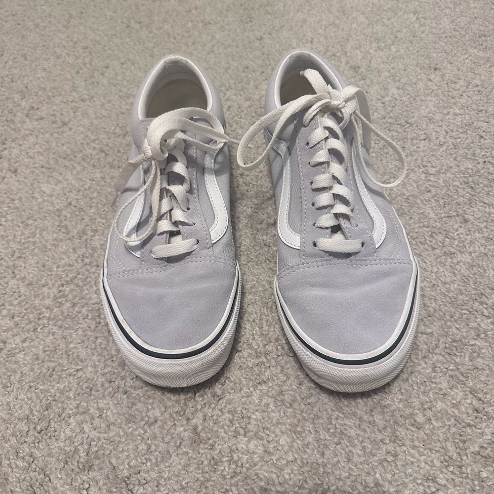 Old Skool Shoe from vans. They tie up and are a light gray color.